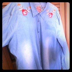 Denim top with flowers on the front and back.